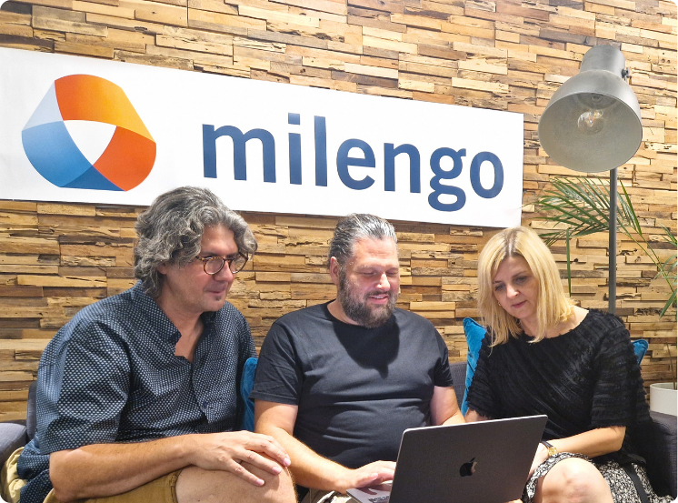 Milengo team having a discussion in the office